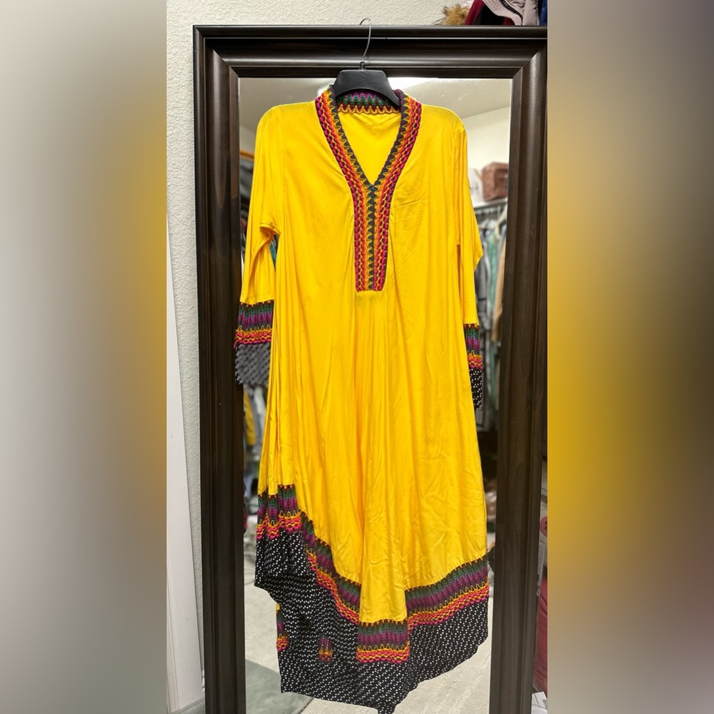 Yellow refreshing dress with embroidered neck and polka dots 4” border patch .